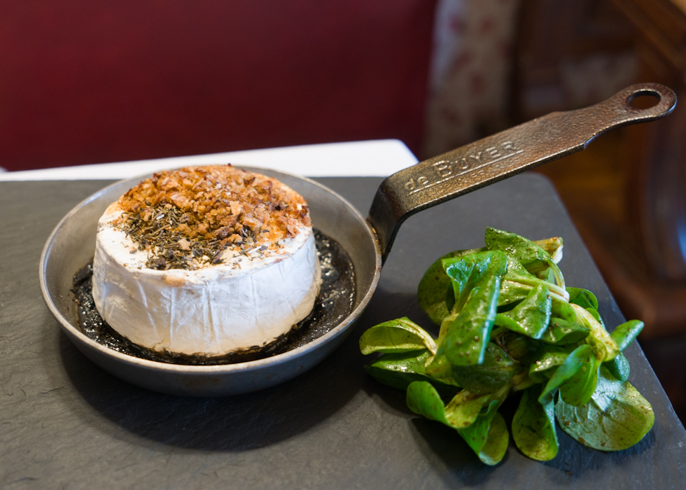 Camembert, baked cheese with honey, Provencal herbs, French Restaurant